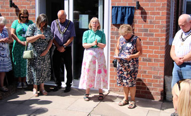Rev Anne Wilkins leading in prayer
